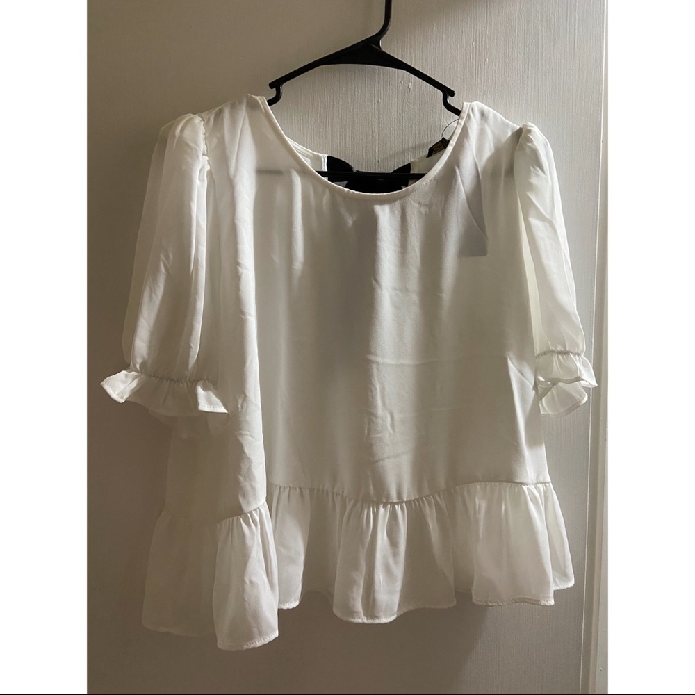 White peplum top
